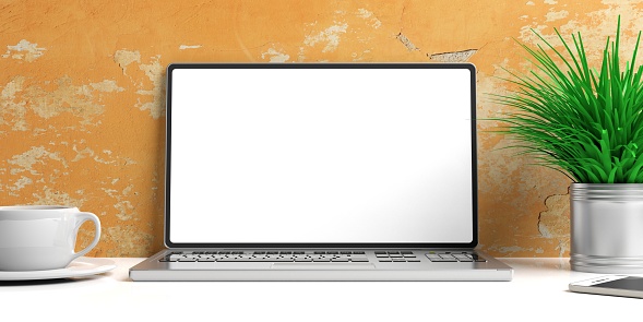 Laptop with blank screen and books on a white desk - painted wall background. 3d illustration