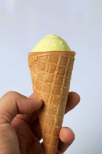 istock The man is holding ice cream in his waffle cone. On a white background. 1024048370