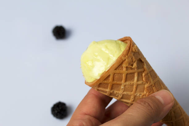 istock The man is holding ice cream in his waffle cone. On a white background. 1024048402