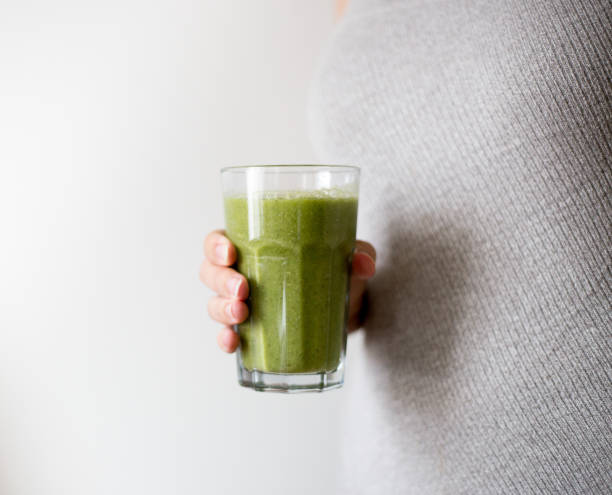 istock Green smoothie with spinach and kiwi. Detox concept 1024052780
