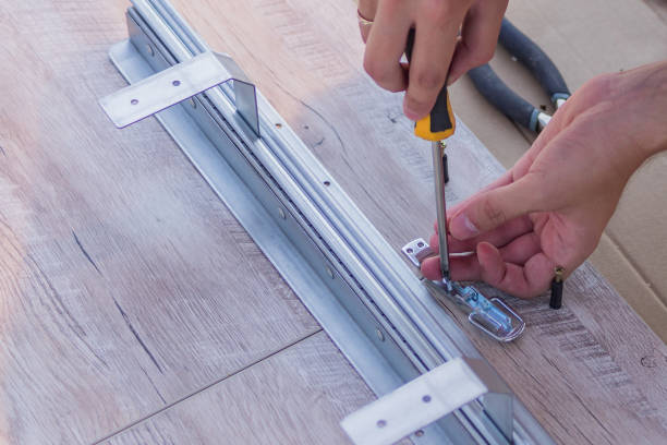 istock furniture assembling - Carpentry screws for a knock down wooden table. 1024055784