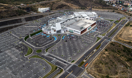 Atizapan, Mexico, March 16, 2015: empty parking lot and big shopping center