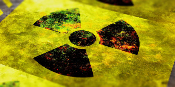 Radiation symbol, yellow background. 3d illustration Radiation symbol on yellow background, view from above. 3d illustration nuclear symbol stock pictures, royalty-free photos & images