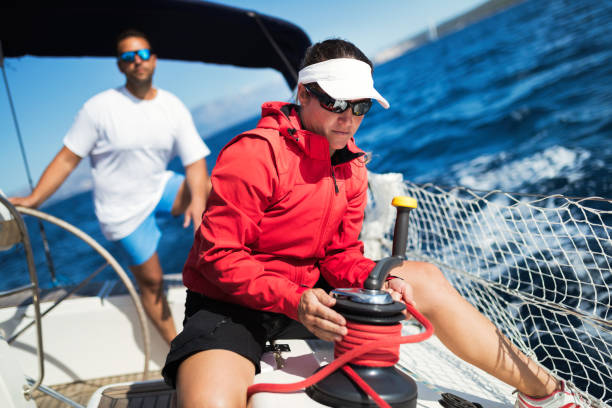 istock Attractive strong woman sailing with her boat 1024069482