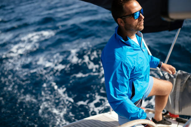 istock Handsome strong man sailing with his boat 1024069610