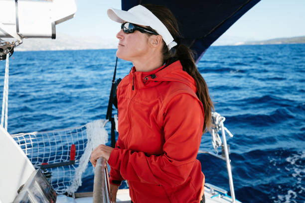 istock Attractive strong woman sailing with her boat 1024070146