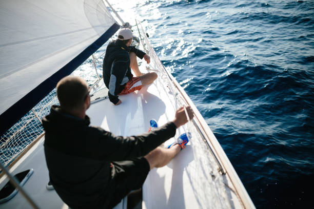 istock Handsome strong men sailing with their boat 1024070348