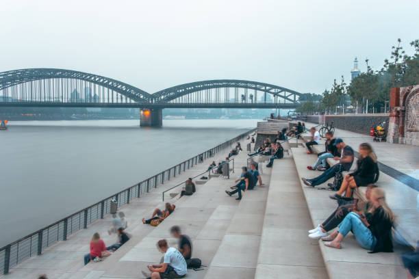 Rhine Staircases (Rheinterrassen), Cologne, Germany, at sunset with people in motion