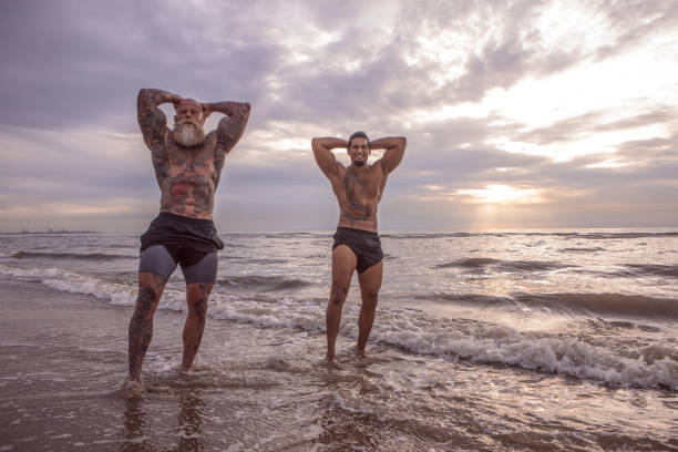 istock Tattooed Senior Man coaching young man During Workout 1024073276