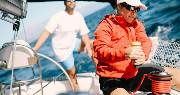 istock Attractive strong woman sailing with her boat 1024078082
