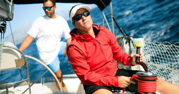 istock Young strong woman sailing the boat 1024078136