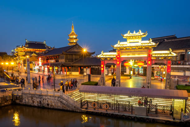 The Nanchan Temple in Wuxi. Wuxi, China - Apr 1, 2018: Tourists are enjoying the night view of the Nanchan Temple. wuxi photos stock pictures, royalty-free photos & images