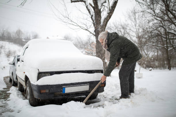 istock Stuck in snow. Senior man with shovel removing snow 1024082376