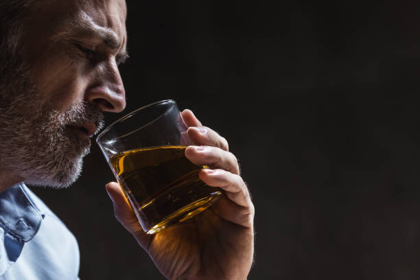 Alcohol addiction Man drinking whiskey. Alcohol addiction concept. alcohol abuse stock pictures, royalty-free photos & images