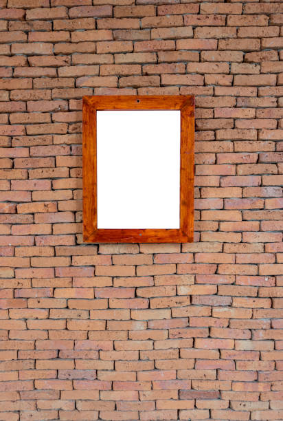 istock Blank wooden frame picture with texture of red brick wall 1024095304