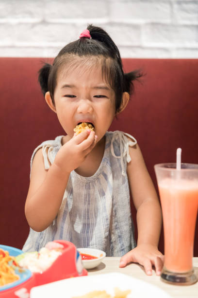 istock Cute baby girl drinking a drink 1024105954