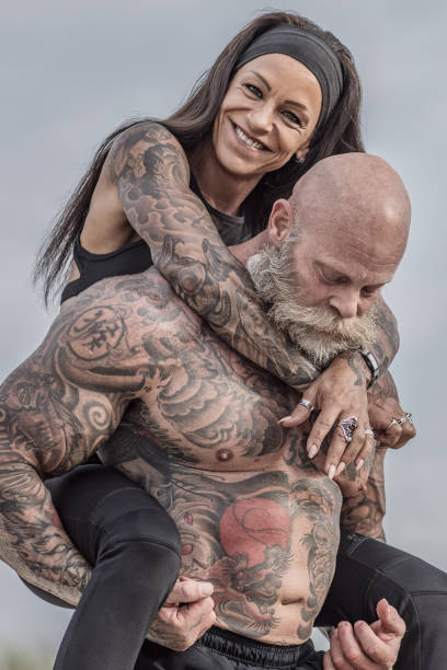 istock Tattooed Senior Couple posing During Workout 1024110222