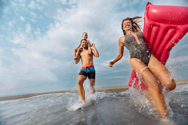 istock Family fun at the beach 1024115484