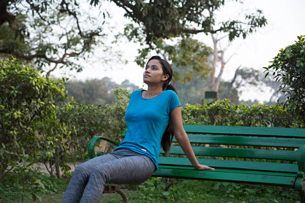 istock Woman doing push ups exercise in outdoor workout - Stock image 1024115638