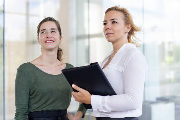 istock Confident estate agents admiring neighbor building 1024115942