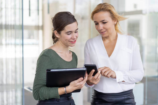 istock Positive office employees testing new mobile app 1024116256
