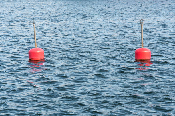 istock Red anchor buoys in water 1024116662