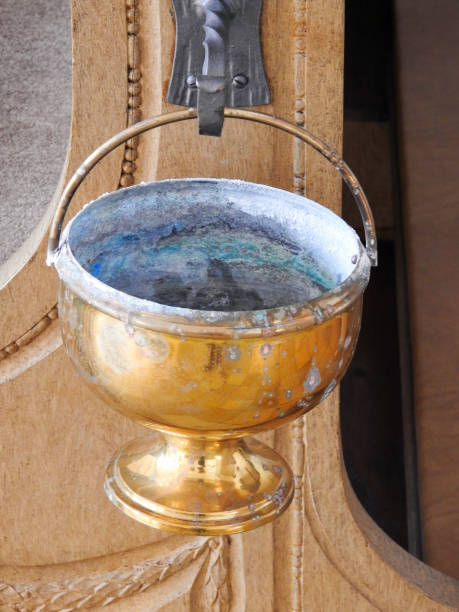 istock Old golden goblet in church 1024120456