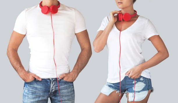 Young couple with red headphones on their necks isolated over gray background