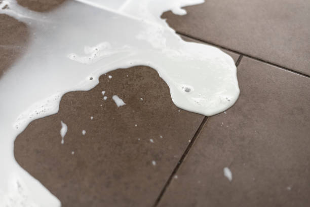istock Spilt milk on a tiled floor 1024123648