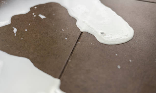 istock Spilt milk on a tiled floor 1024123650
