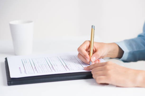 istock Closeup of candidate signing application form 1024124166