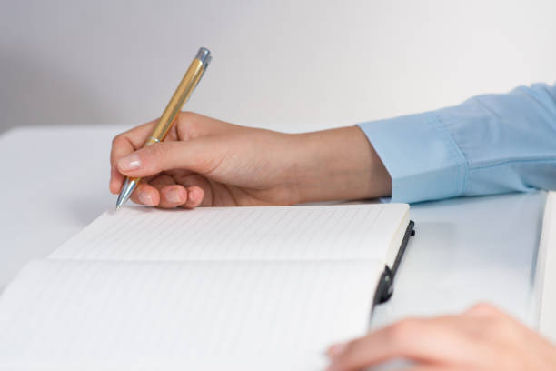 istock Closeup of business person making notes in notebook 1024124204
