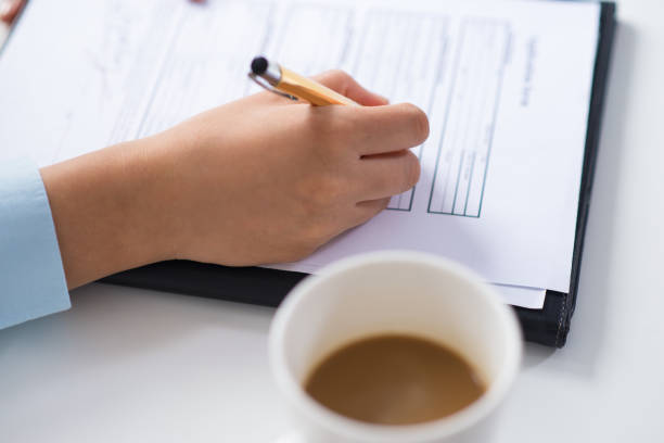 istock Closeup of business person making notes in document 1024124356