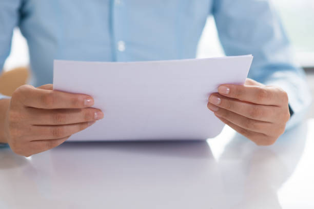 istock Closeup of person reading document 1024124826