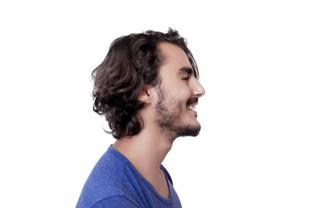 Profile view of smiling young man stock photo