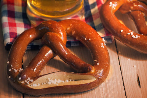 istock Pretzel with beer on wood table,Oktober background. 1024128078