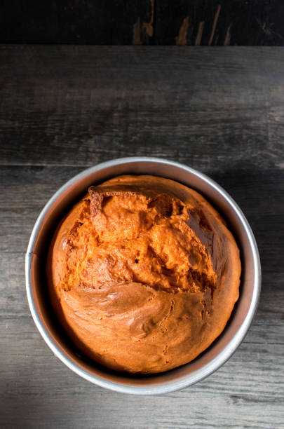 istock orange cake baked in round cake pan 1024130036