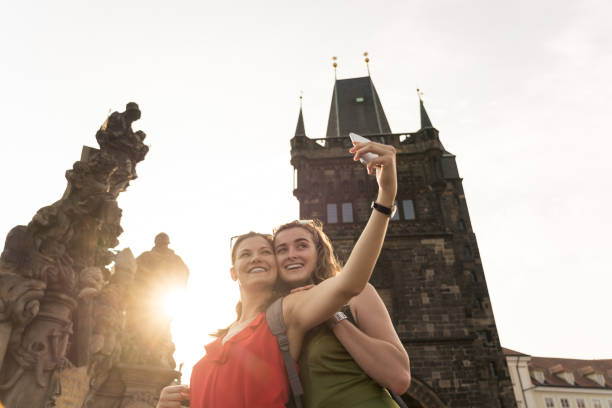 istock Female tourists taking selfie with old monument 1024130292