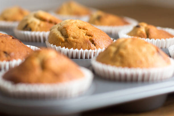 Tray of freshly bakes banana and chocolate chip muffins
