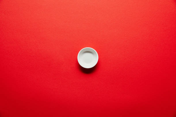 istock top view of white empty bowl for soya sauce on red backdrop 1024131576