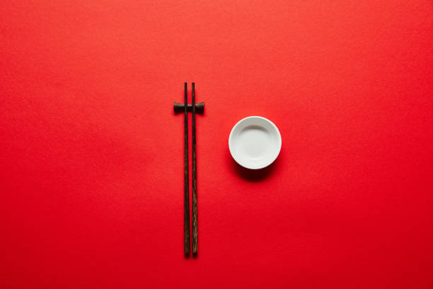 istock top view of arranged chopsticks and empty bowl on red backdrop 1024131584