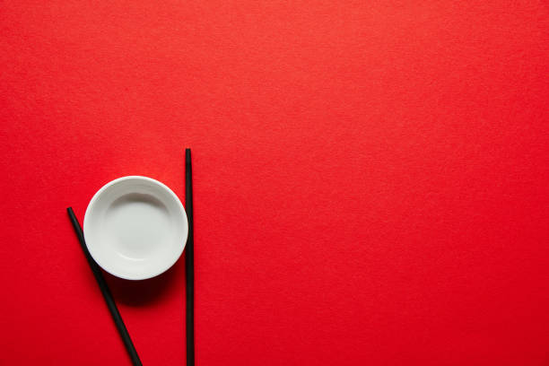 istock top view of arranged chopsticks and empty bowl on red backdrop 1024131598