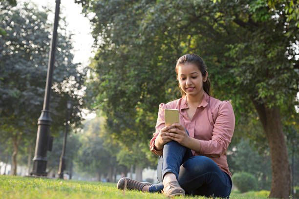 istock Girl using a smart phone in summer - Stock image 1024134078