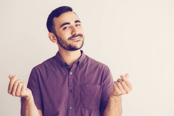 istock Content Man Rubbing Fingers and Asking for Money 1024144770