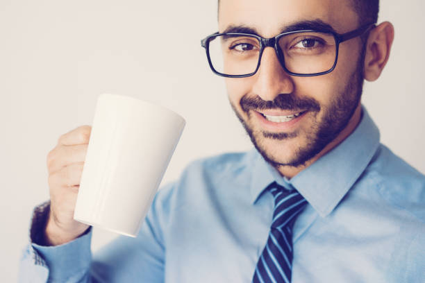 istock Closeup of Content Handsome Man Having Tea 1024144780