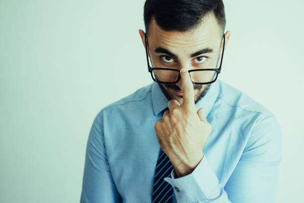 istock Handsome Business Man Adjusting Glasses 1024144812