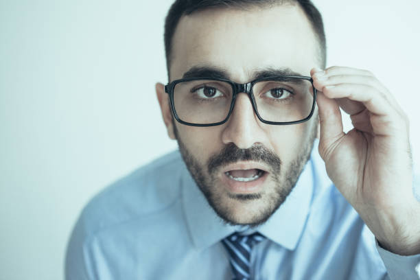 istock Surprised Business Man Staring Through Glasses 1024145060