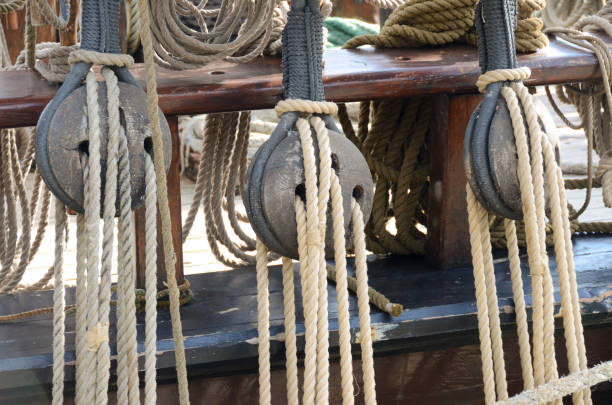 old pulleys and ropes stock photo