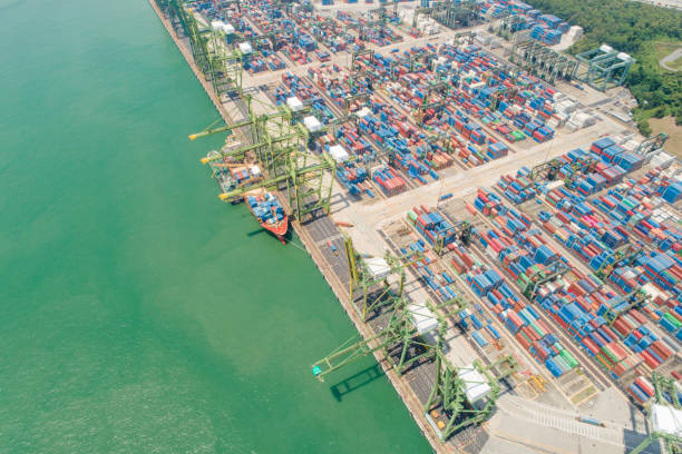 istock Container Cargo freight ship with working crane bridge in shipyard in singapore 1024145132