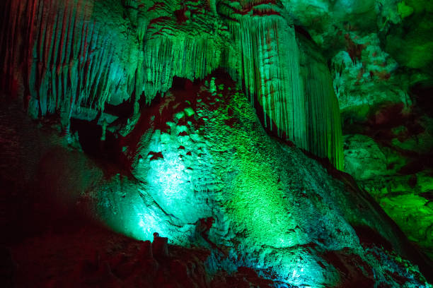 istock large inflow in the cave with green illumination 1024145376